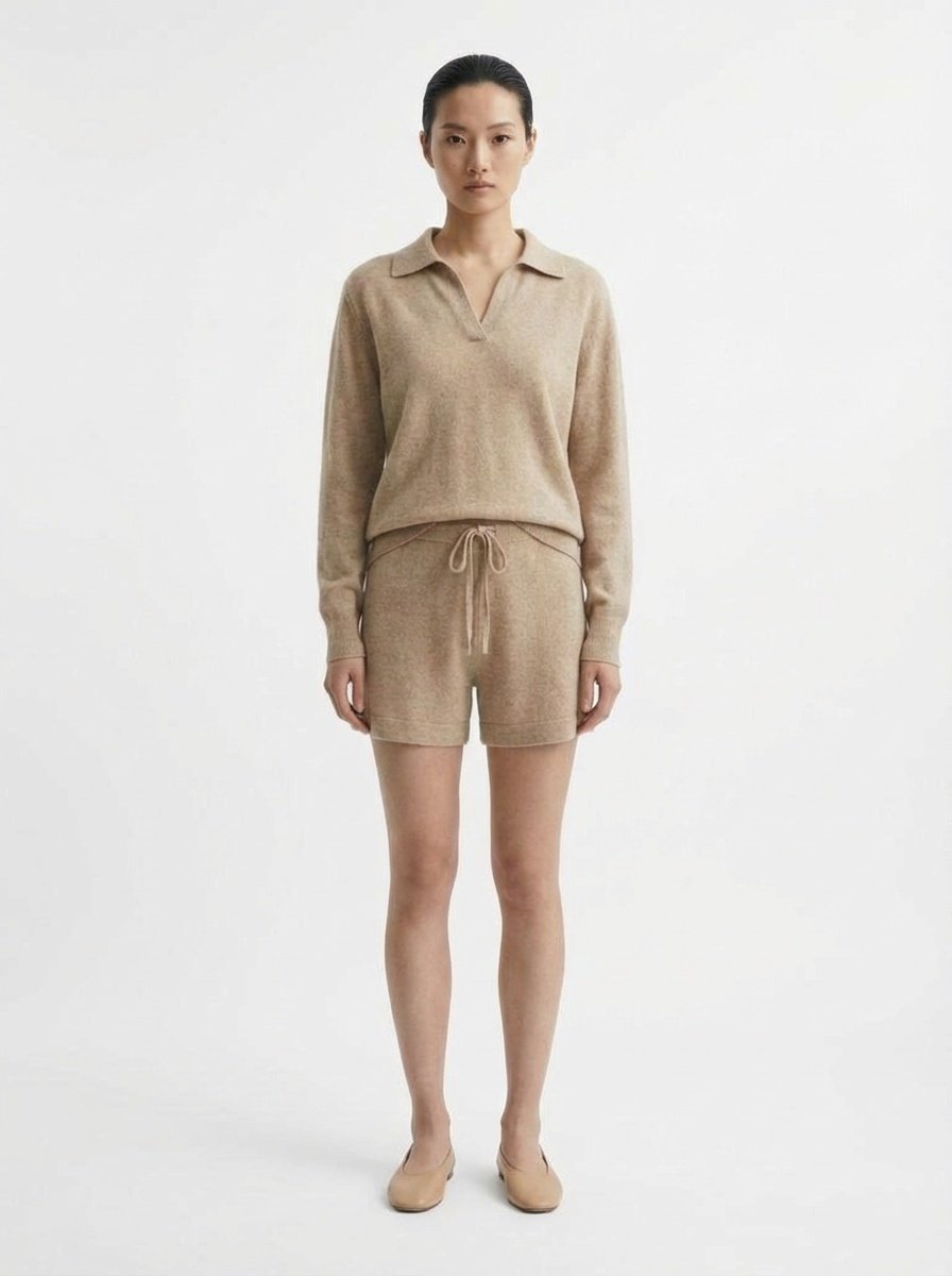 Woman wearing a beige Lena 100% Cashmere crew neck sweater sets on a white background